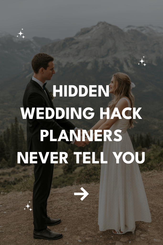 Couple in elegant wedding attire surrounded by mountains, celebrating love in natures beauty.