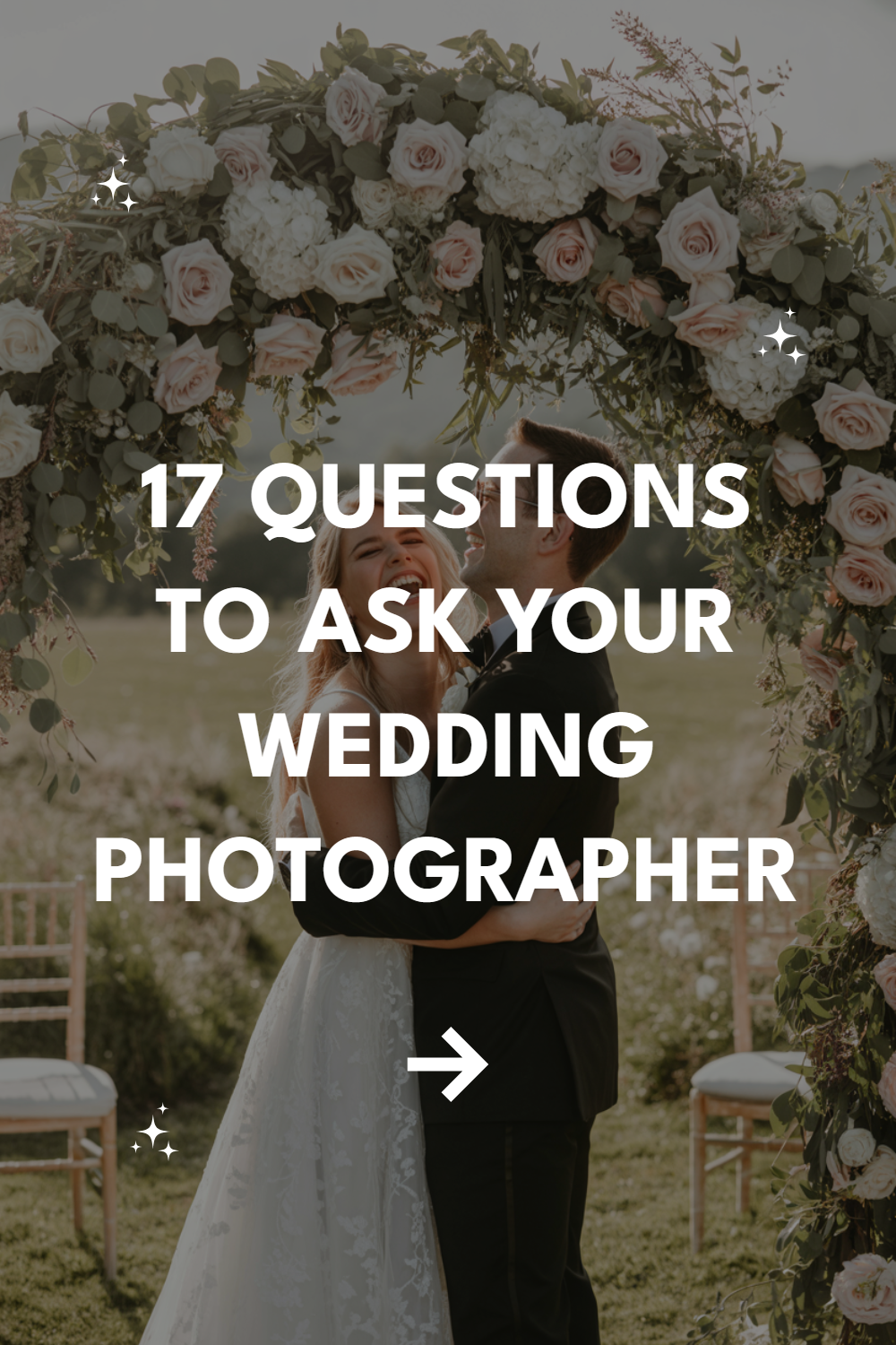 Couple embraces under floral arch, highlighting wedding joy and essential photography questions.