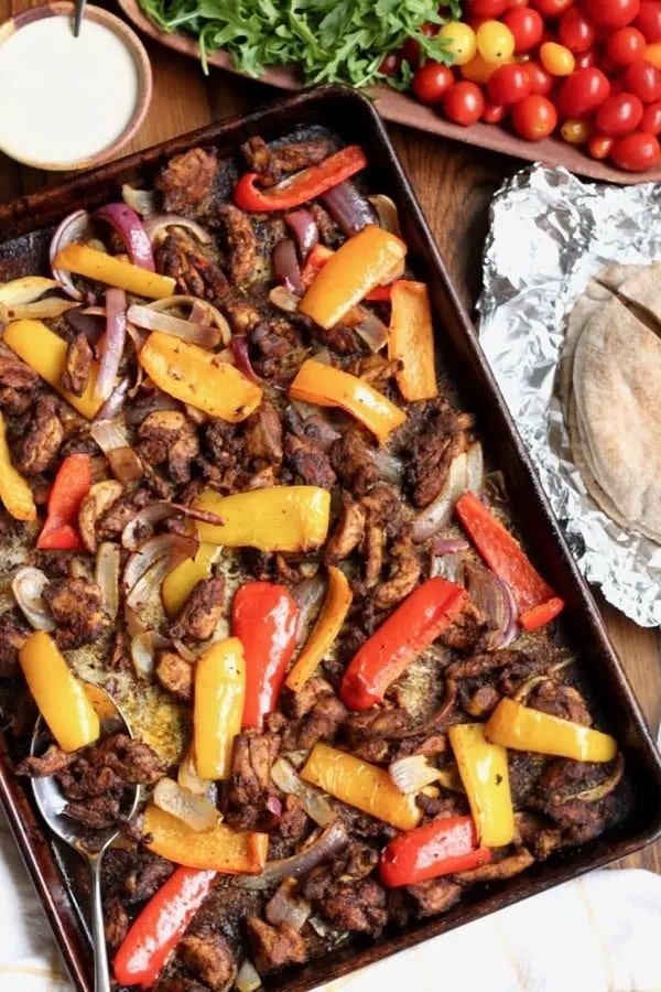 Chicken shawarma cooked in a sheet pan.