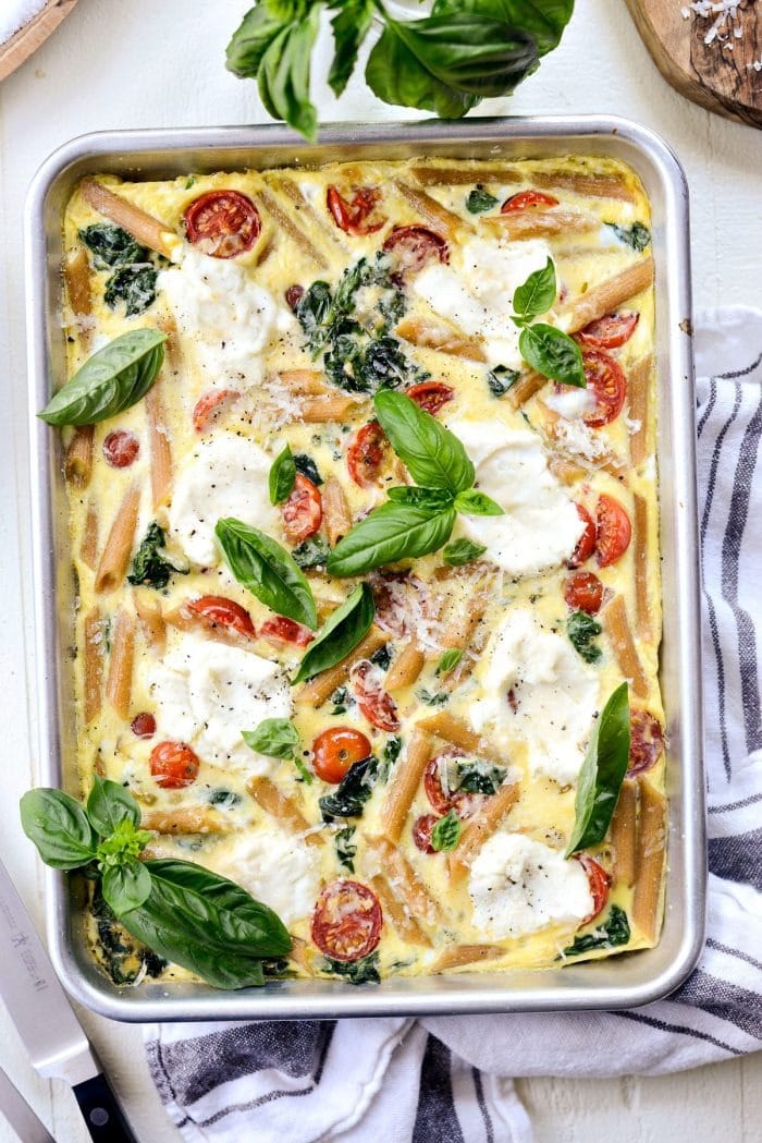 Sheet pan spinach tomato ricotta pasta frittata.