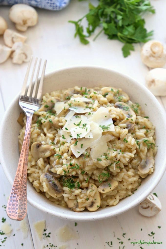Mushroom risotto on a white bowl.