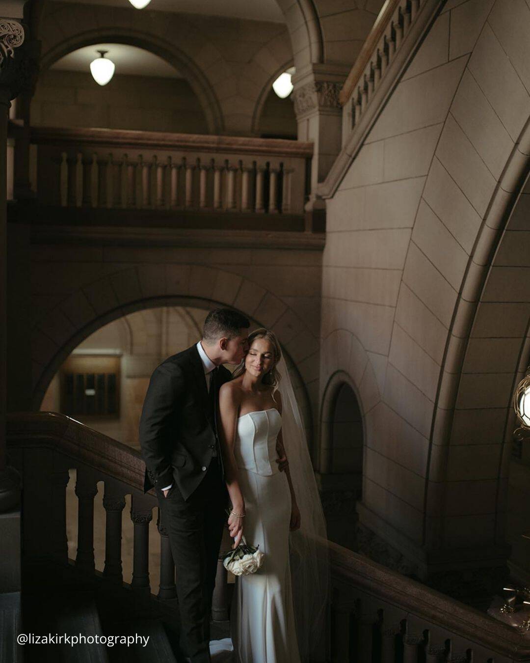 The Groom Kisses Bride's Forehead Tenderly