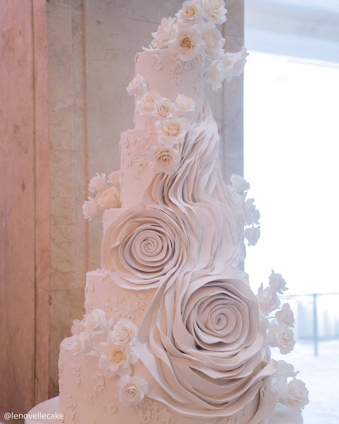 unique wedding cakes tall white sculptural cake with large sugar roses lenovellecake
