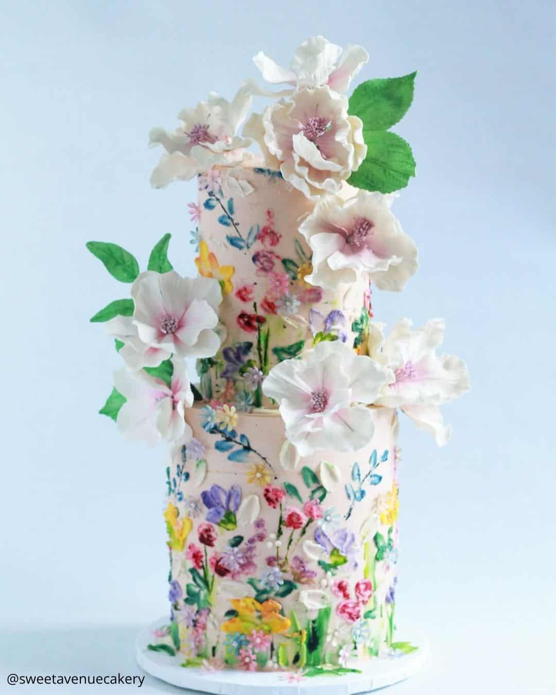 unique wedding cakes two tier cake with painted colorful wildflowers sweetavenuecakery