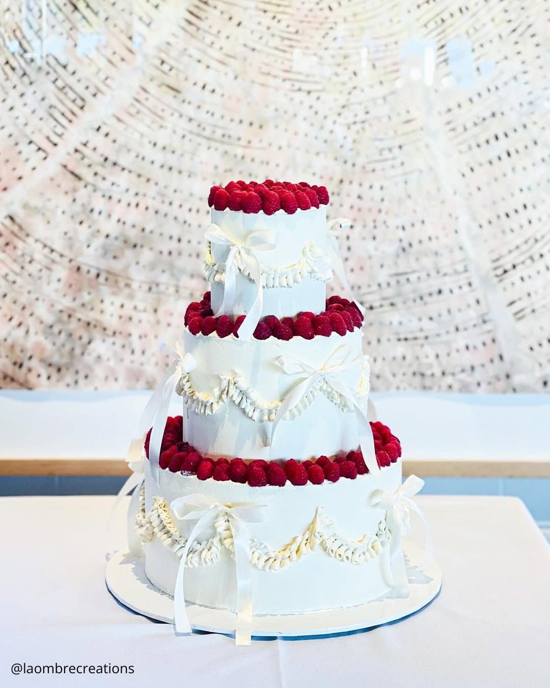 unique wedding cakes three tiered white cake with fresh raspberries and bows laombrecreations