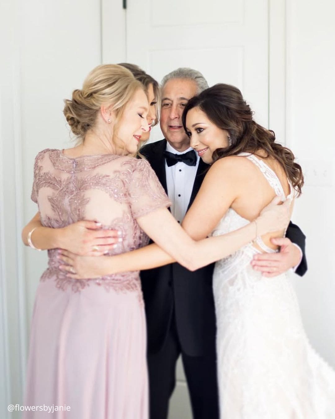 Bride and groom with both sets of parents
