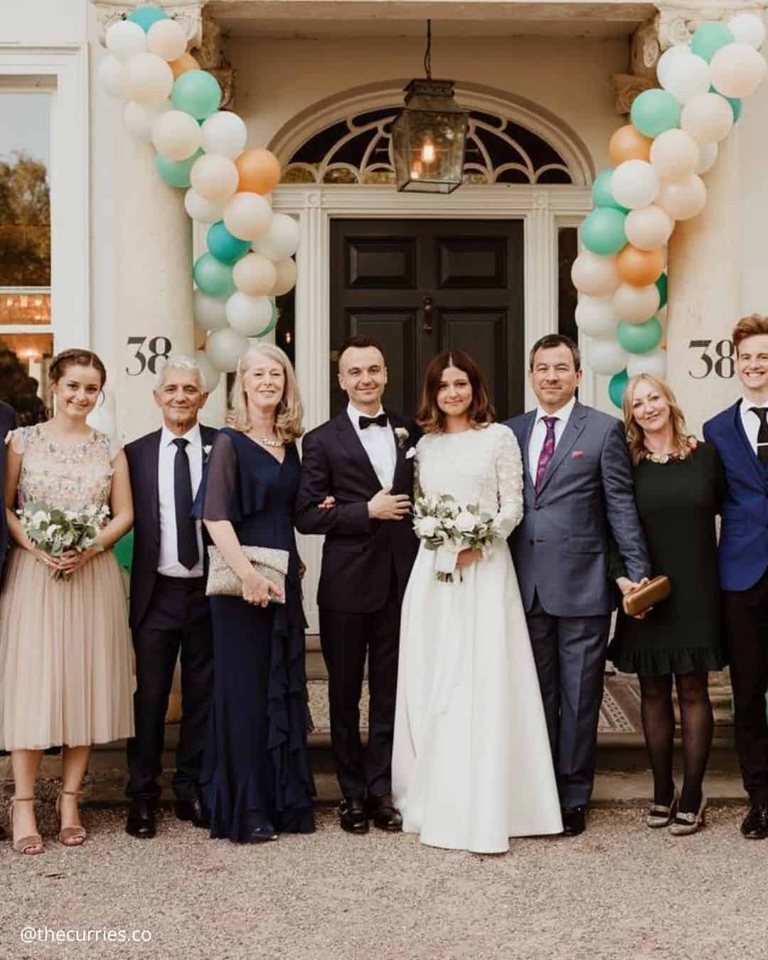 Bride and groom with nieces, nephews, or young relatives
