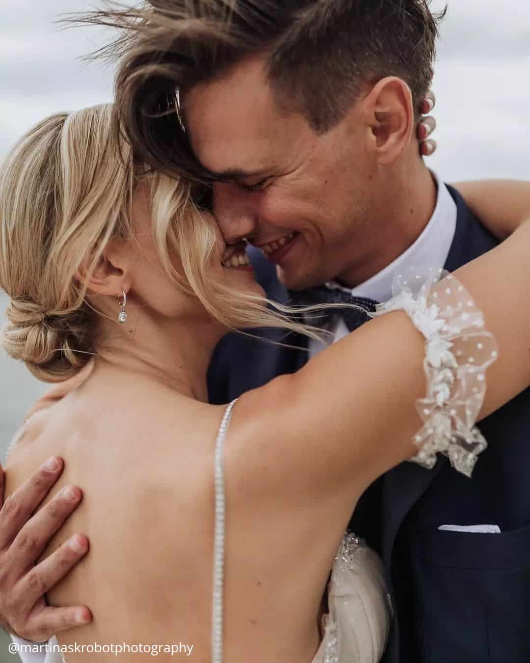 wedding photos cute photos of brides hugs smile wind blowing hair martinaskrobotphotography