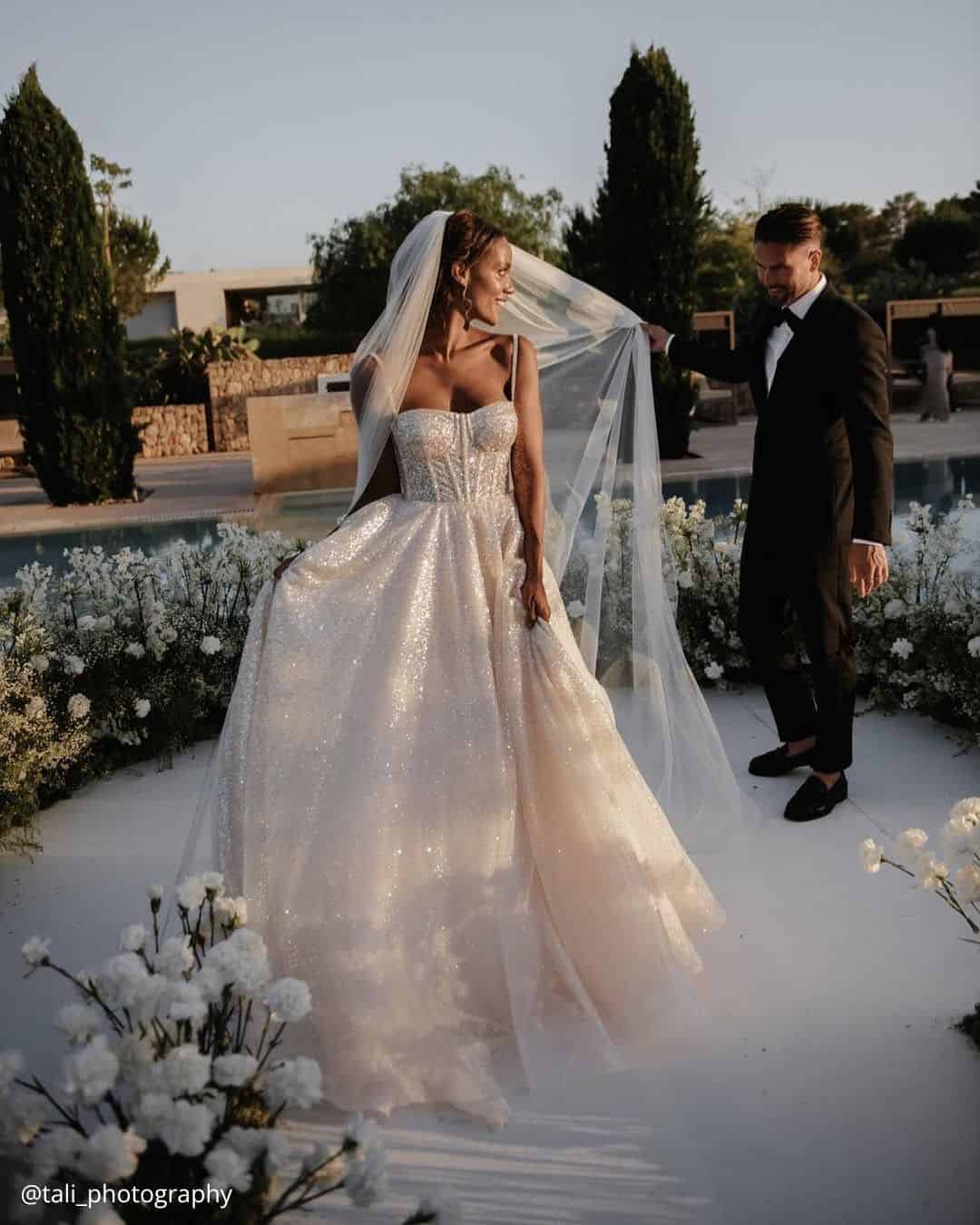 wedding photos first dance traditional of the happy brides he holds her veil tali photography