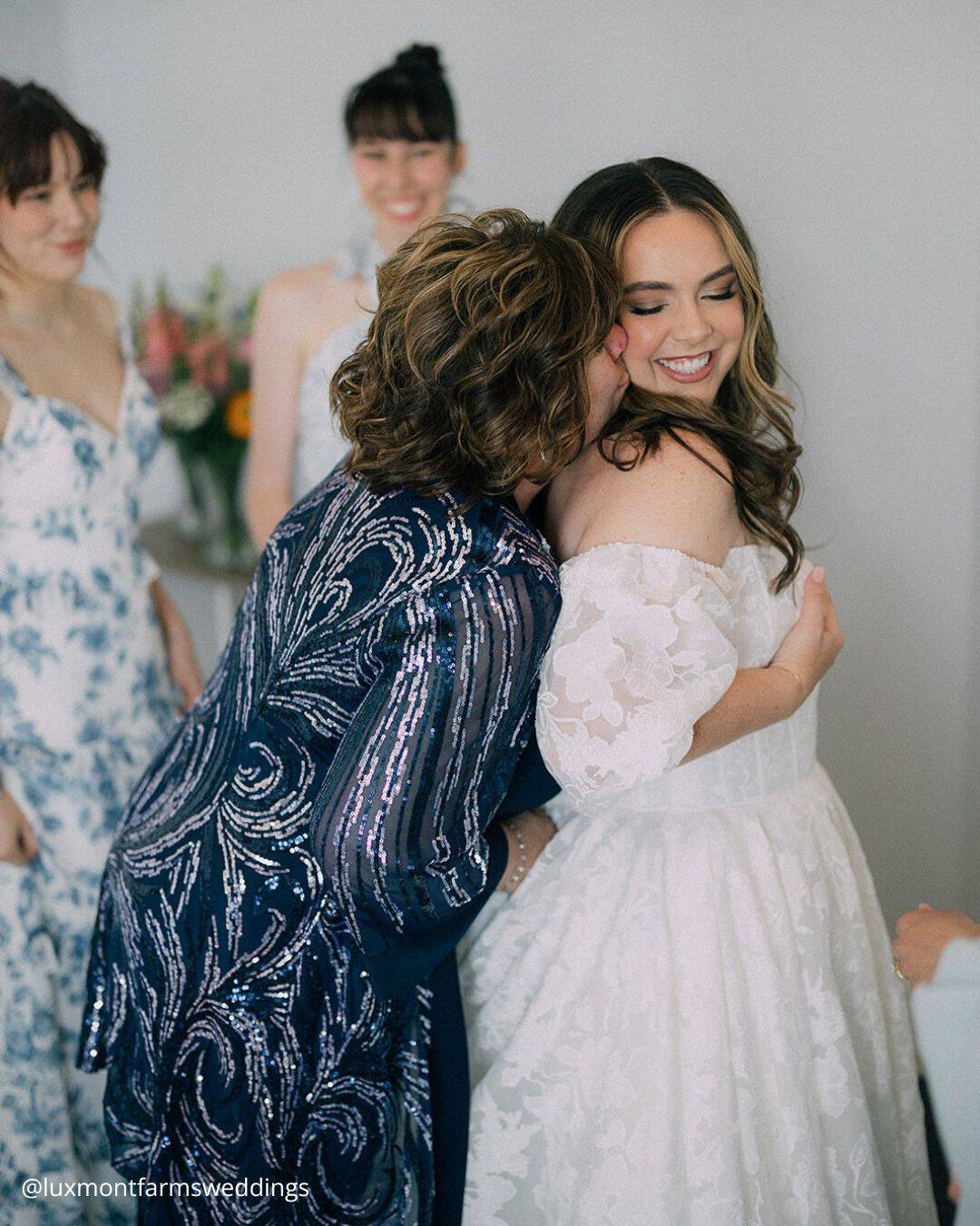 wedding photos family photo mom kissing the bride luxmontfarmsweddings