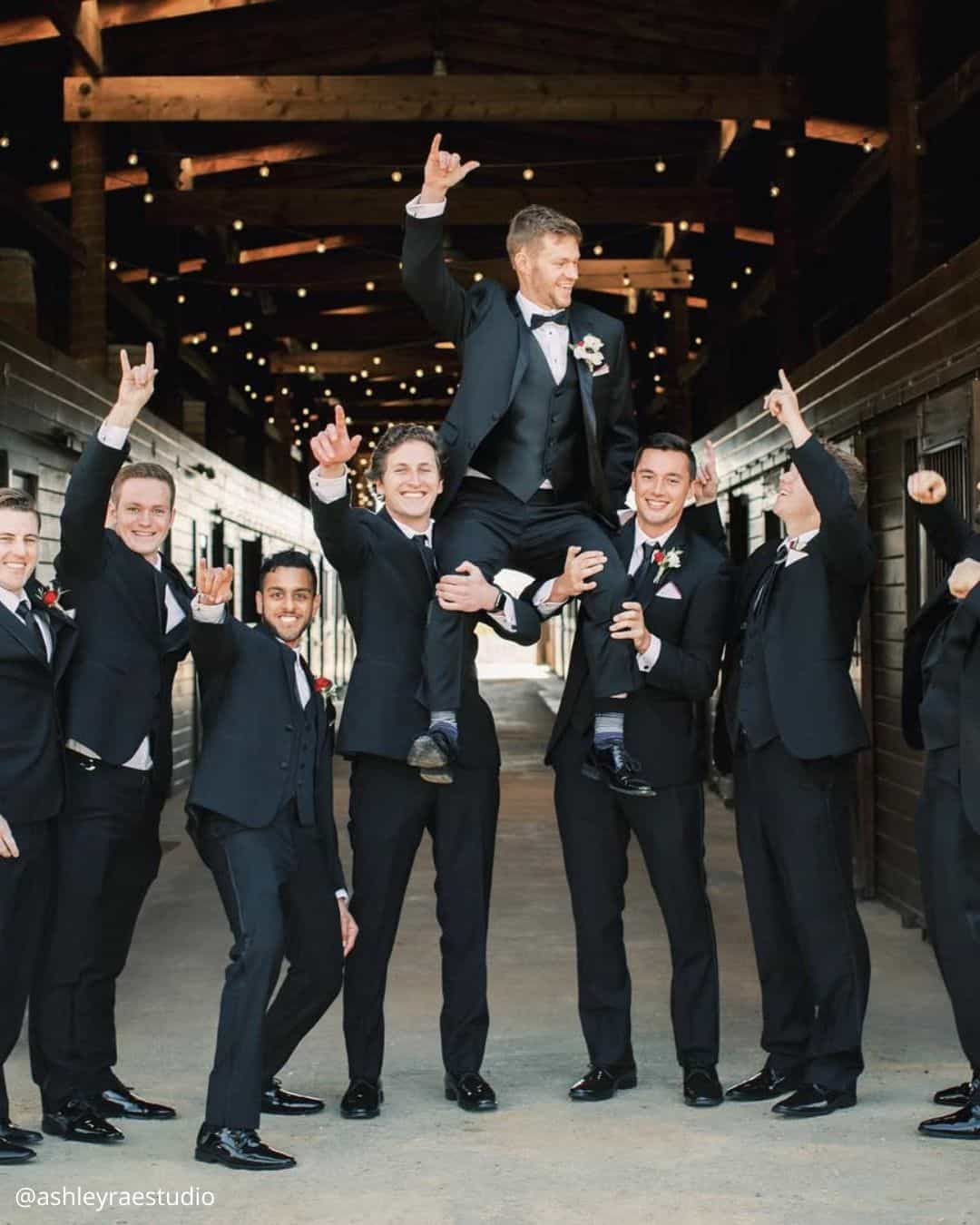 wedding photos groom with friends they hold him on hands funny photo ashleyraestudio