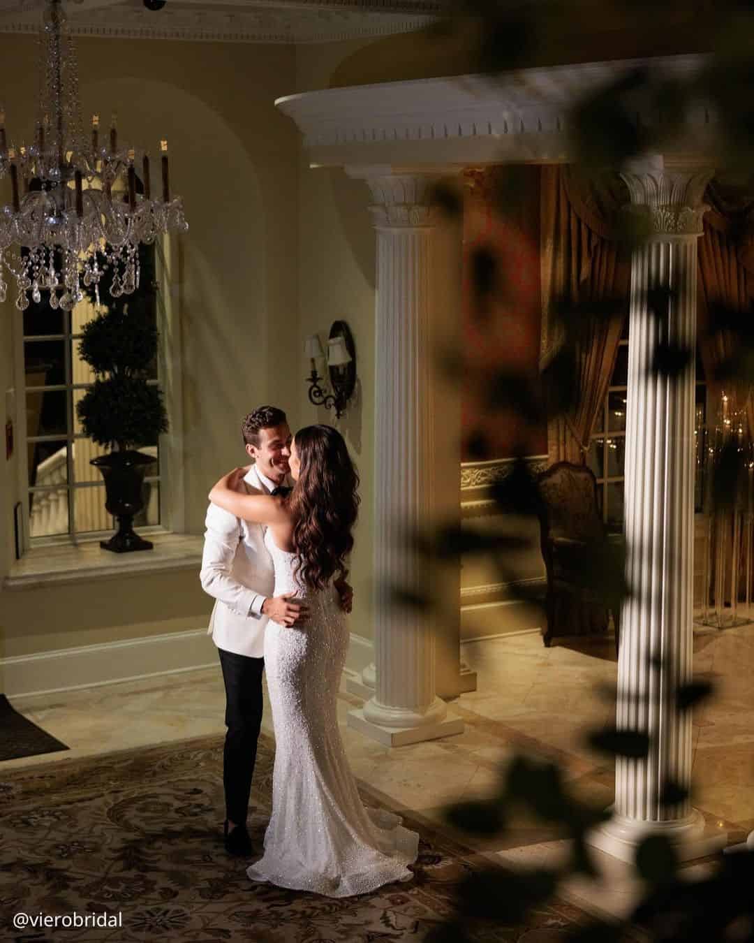 wedding photos magical night evening of brides in the hotel hugging standing by the columns vierobridal