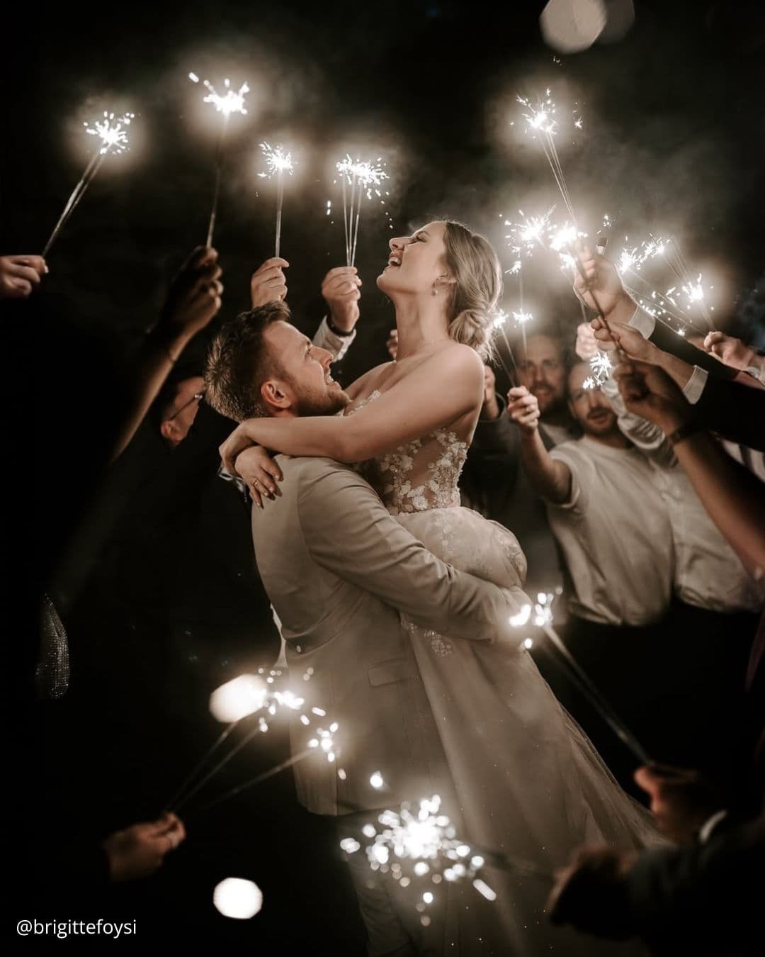 wedding photos magical night of happy brides on the background of bengal lights holding the guests brigittefoysi