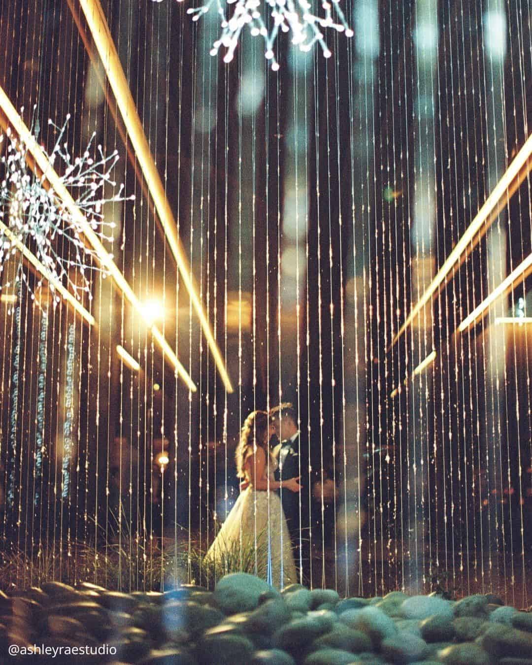 wedding photos fun evening photo brides hugging with lights shining ashleyraestudio