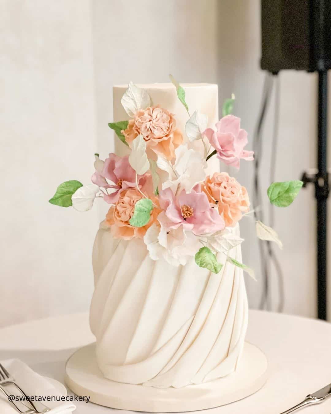 wedding cake trends small cream two tier ruffled wedding cake with peach sugar flowers