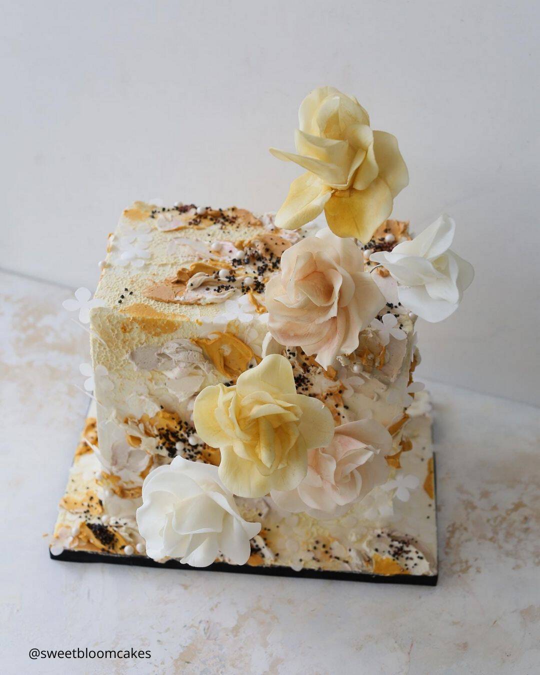 wedding cake trends small white square wedding cake in peach colors with yellow sugar roses