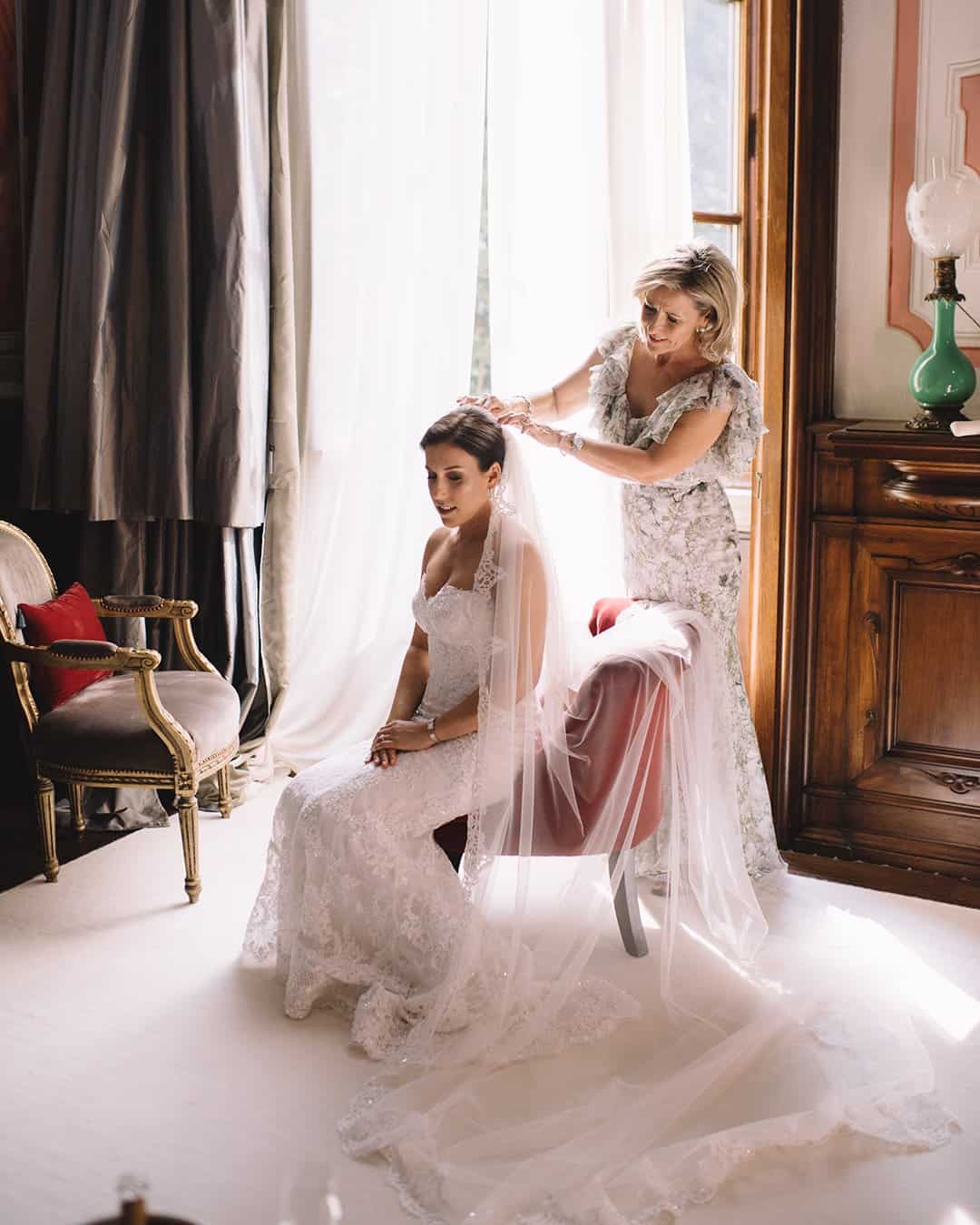 romantic real wedding in florence putting veil