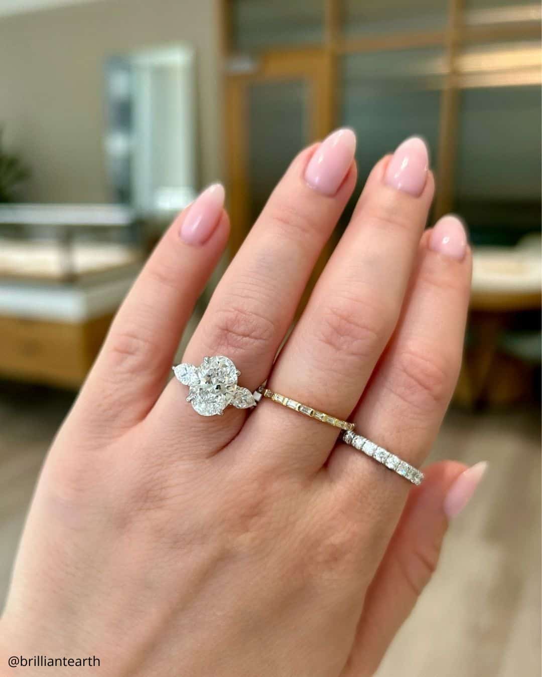 Round Cut Three Stone Rings